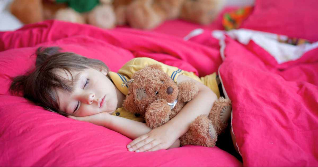 Toddler sleeping peacefully in a calm and cozy bedroom.