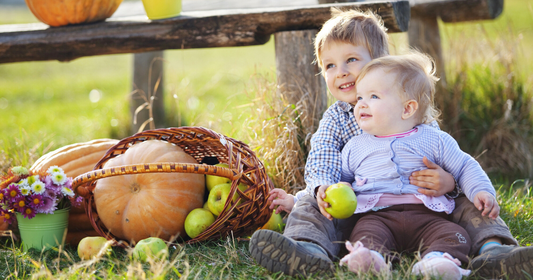 Kids smiling and enjoying a relaxing, fun-filled autumn day.