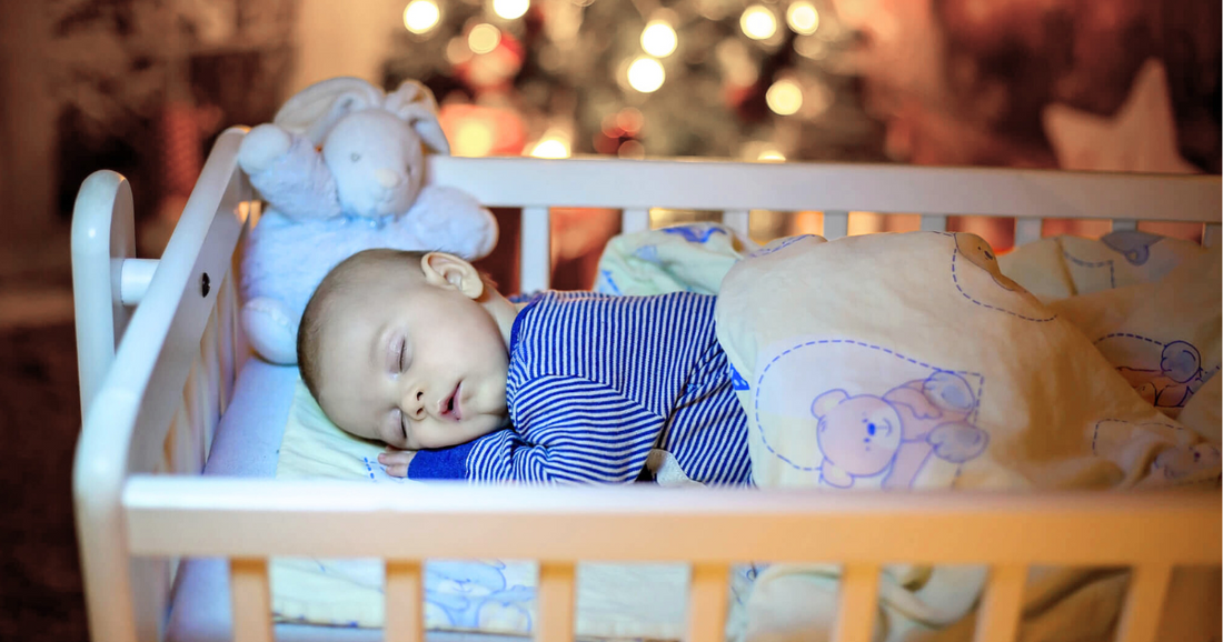 Infant sleeping soundly in a peaceful, restful position at night.