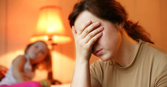 Tired woman longing for rest after a stressful day, struggling to stay awake.