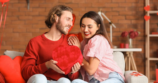 Happy couple celebrating Valentine's Day at home.