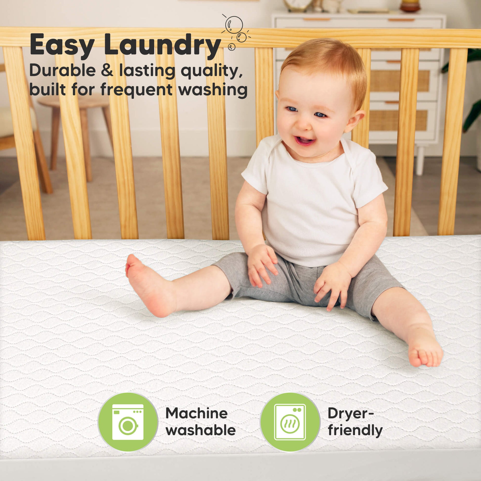 Machine-washable crib mattress protector designed for frequent washing and durability. 31213584974010