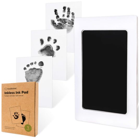 Inkless baby handprint and footprint kit with black ink pad, sample prints, and kraft packaging