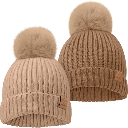 Two cozy knitted baby beanies with soft pom-pom tops
 28177357603002