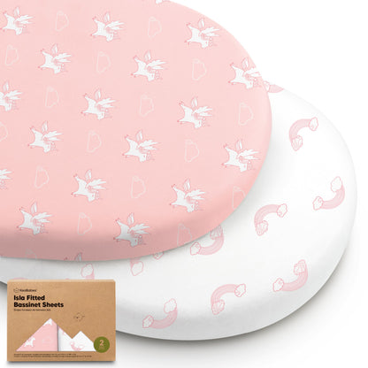 Two fitted bassinet sheets in pink unicorn and rainbow prints with packaging 28688404873402