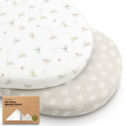 Two bassinet fitted sheets in dragonfly and floral prints, shown stacked with product packaging. 29635950510266