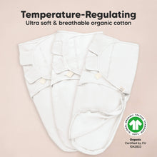 Load image into Gallery viewer, White organic cotton baby wrap with text on a beige background
